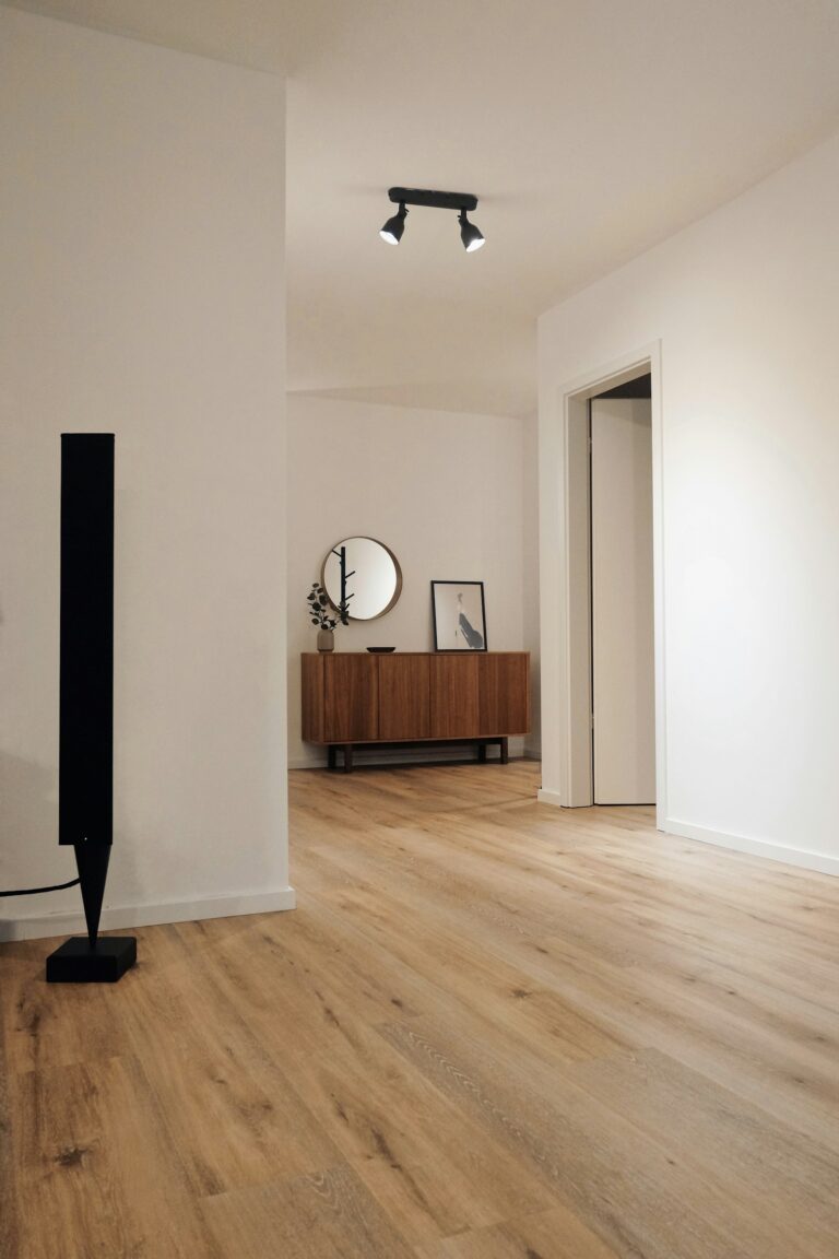 Finished room with hardwood flooring - Haven Renovations